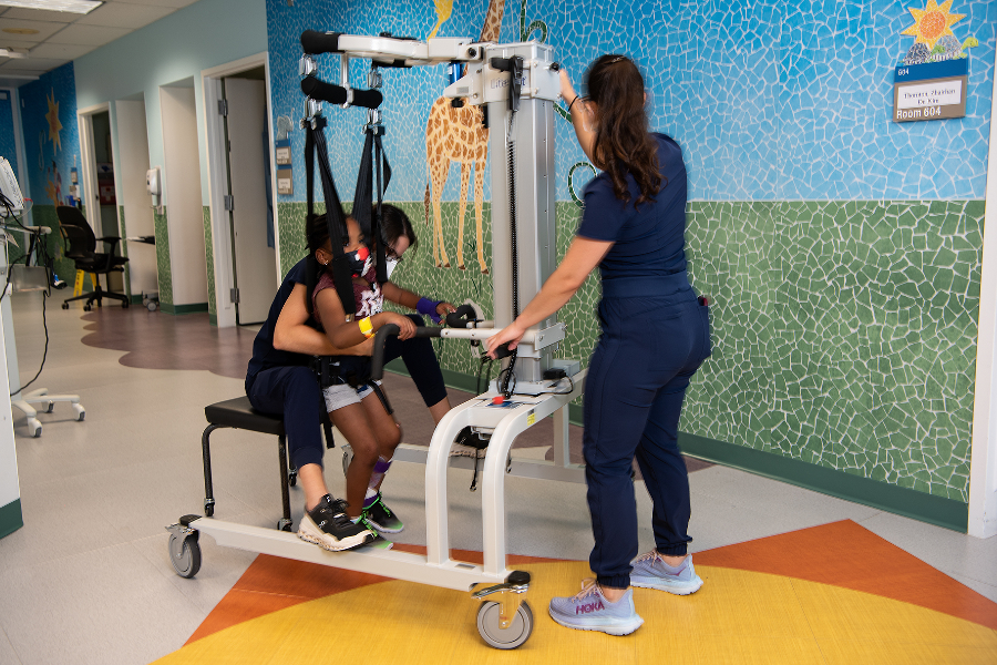 Assistive equipment is utilized for a child at TIRR Memorial Hermann.