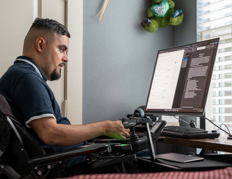 TIRR Memorial Hermann patient, Angel Maldonado, uses assistive devices.
