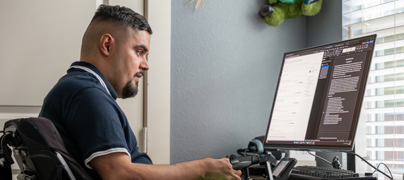 TIRR Memorial Hermann patient, Angel Maldonado, uses assistive devices.
