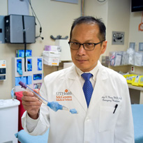 Doctor holding test tube for research