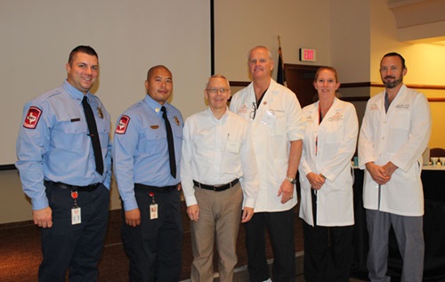 Physicians and EMS pose for a photo
