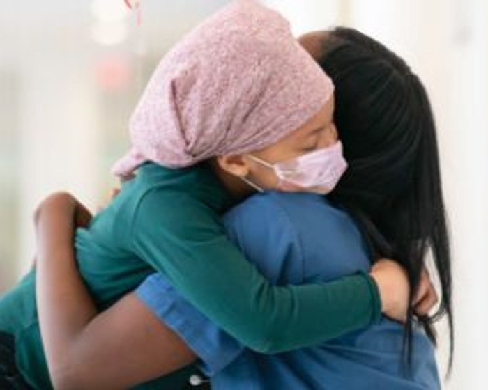doctor hugging young patient
