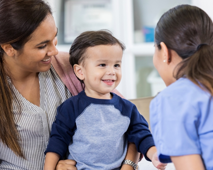 toddler boy listening to doctor