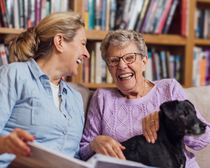 women smiling with dog