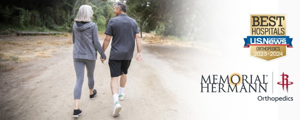 Couple walking along trail