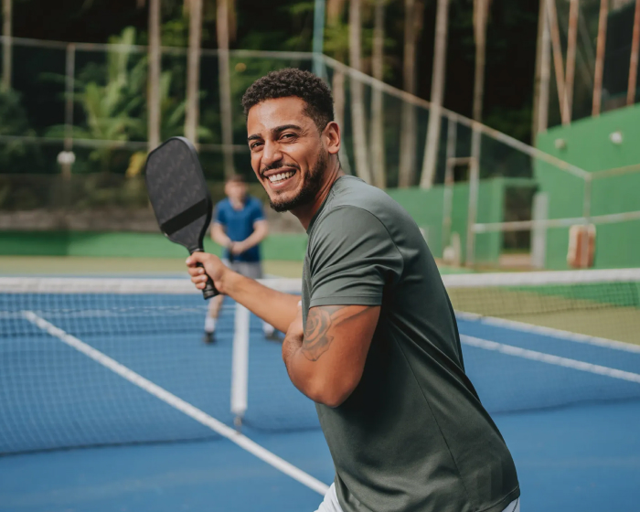Man playing pickleball.