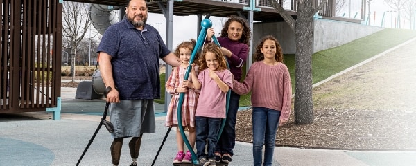 TIRR Memorial Hermann Ossiointegration patient stands with his family