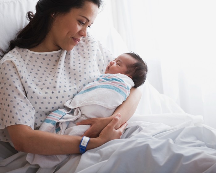woman holding newborn