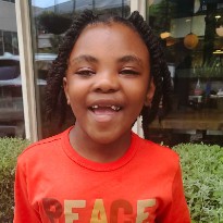 TIRR Memorial Hermann former patient, Zion Walker, smiles for the camera.