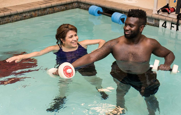 Man does aquatic therapy in pool