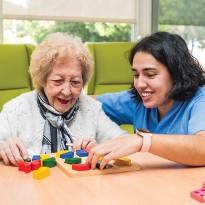 TIRR Memorial Hermann therapist and patient work side-by-side.