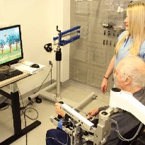 TIRR Memorial Hermann therapist uses technology to rehabilitate a patient.