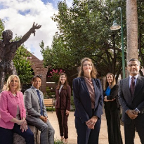 The TIRR Memorial Hermann Leadership team stands proudly at the entrance to the rehabilitation facility.
