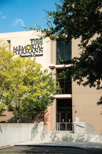The tree-framed entrance to TIRR Memorial Hermann's Research Center